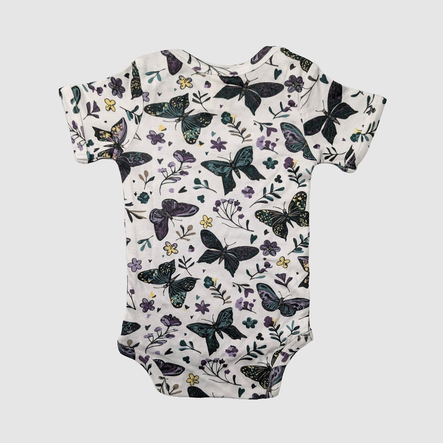 Lap neck baby onesie with butterfly and floral pattern on a white background