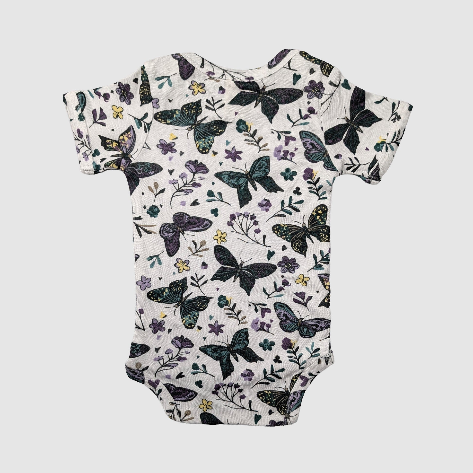 Lap neck baby onesie with butterfly and floral pattern on a white background