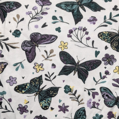 Baby onesie with butterfly and floral pattern on a white background