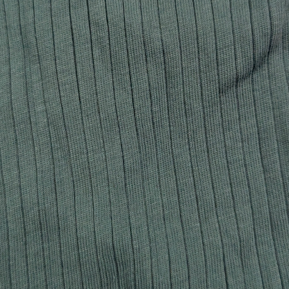 Close-up of green ribbed fabric texture organic cotton