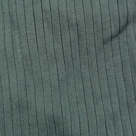 Close-up of green ribbed fabric texture organic cotton