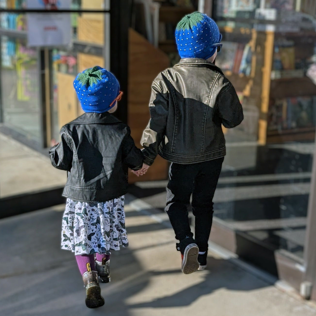 alternative kids clothes punk rock style walking hand in hand.