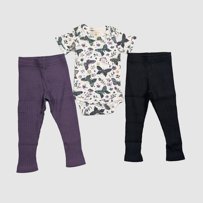 Two pairs of kids pants and a dark butterfly onesie