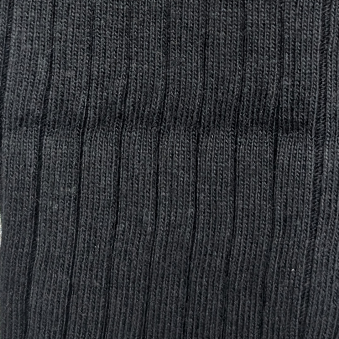 Close-up of a textured ribbed black fabric organic cotton